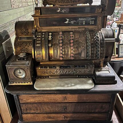 This is a 1908 National Cash Register with a Time Clock